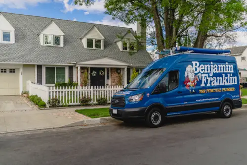 Benjamin Franklin Plumbing van parked outside a residential home in Pompano Beach, showcasing professional plumbing services. Which Option Is Best Hydro-Jetting VS Snaking